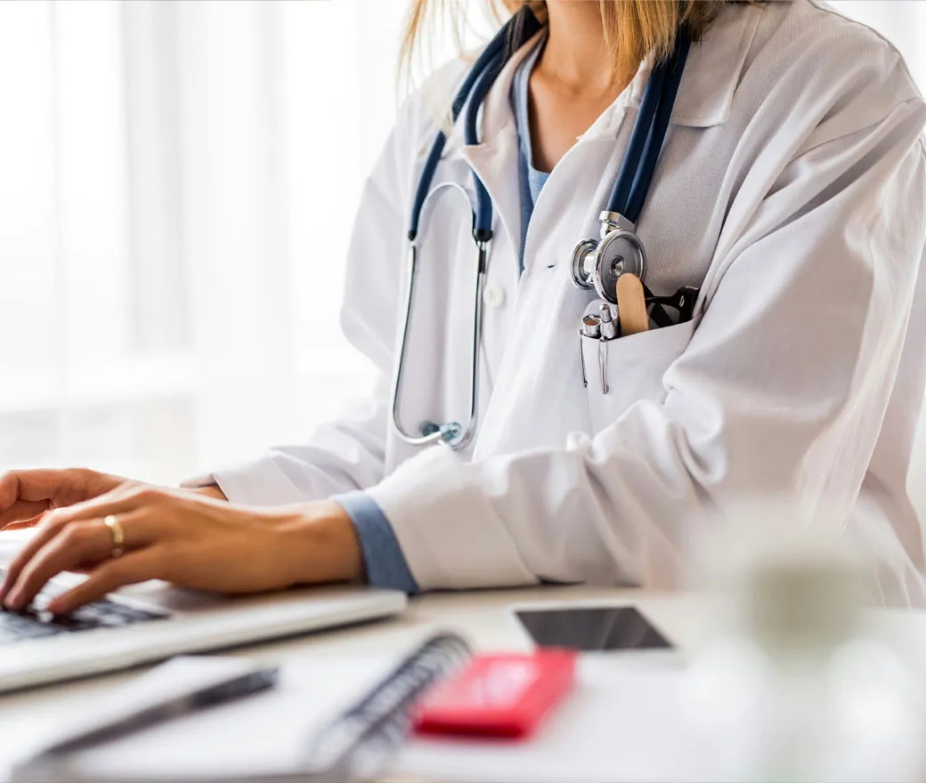 Healthcare professional completing an online human factors course on a laptop