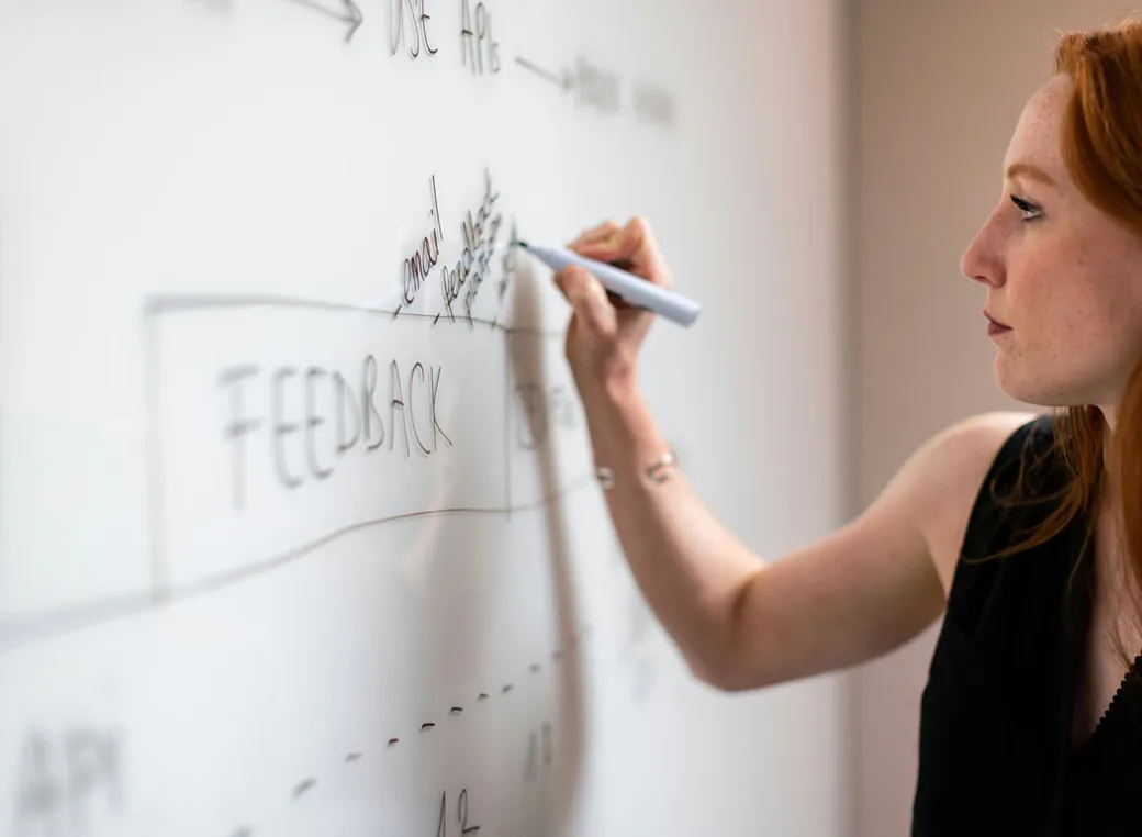 Healthcare professionals in a trainer refresher workshop refining their facilitation skills